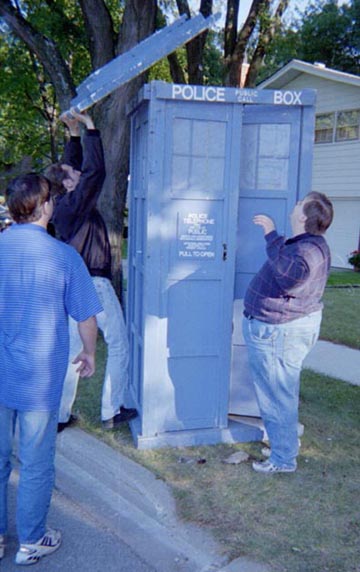 With the strength of a thousand men, he mightily heaves the roof from the time-space capsule.
